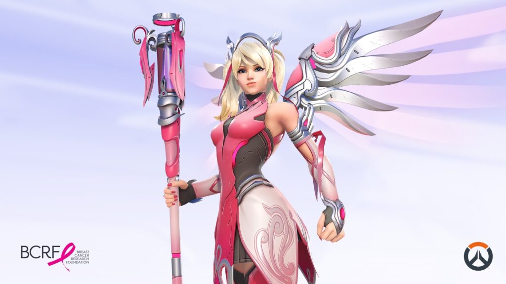 Mercy in her Pink skin from Overwatch, wearing a sleek pink and white outfit with silver wings, holding her staff, with Breast Cancer Research Foundation and Overwatch logos visible in the corners.