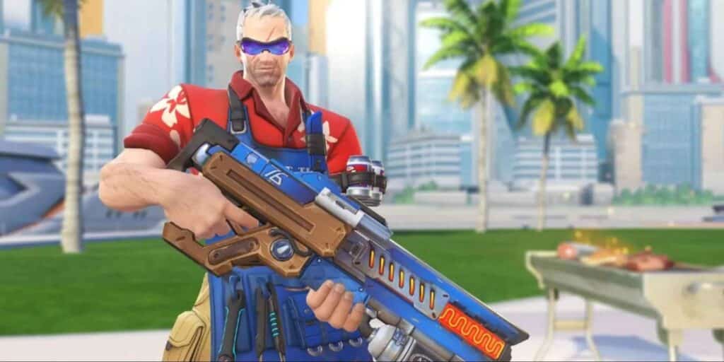 A character from Overwatch 2 in a red Hawaiian shirt and blue sunglasses holding a futuristic weapon stands confidently before a cityscape with palm trees and a barbecue grill.