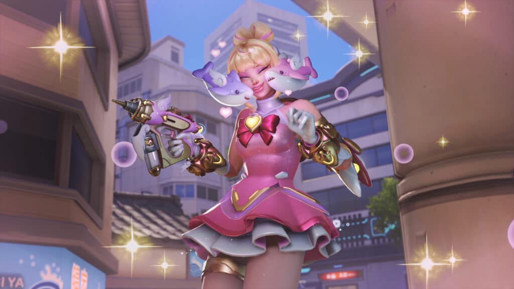 Juno in a pink, playful outfit holds a themed gun, surrounded by sparkles and bubbles