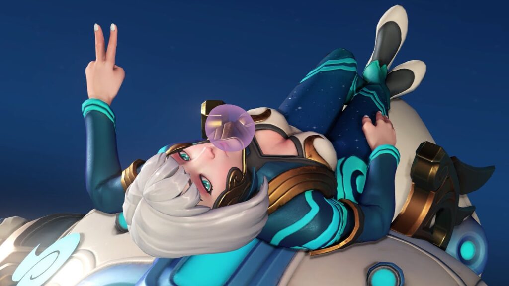 D.Va with silver hair blows a pink bubblegum bubble and flashes a peace sign while lounging on a futuristic, glowing hoverboard